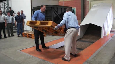 The event was marked by a ceremonial pallet drop into the facility's wood shredder.