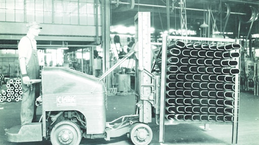 The 1928 CLARK Tructier was an internal combustion powered lift truck that featured hydraulics to elevate a load as well as front-wheel drive.