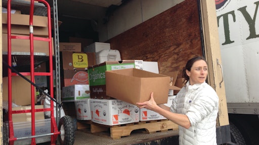Idaho’s Bounty Co-op, a food hub in Southern Idaho, serves the wholesale market as well as consumers directly. Employee Lynea Petty loads a delivery truck.