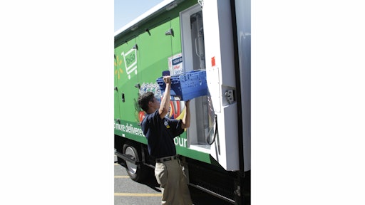 an_associate_loads_a_truck_for_walmart_to_go_home_delivery
