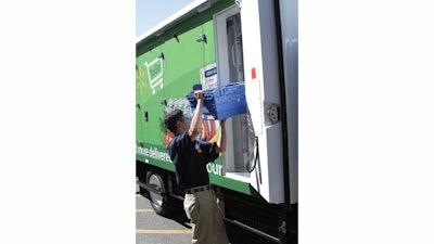 an_associate_loads_a_truck_for_walmart_to_go_home_delivery