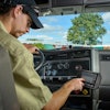 A driver enters hours of service information using a Cadec onboard computer.