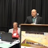 Sean Jones explains Eby-Brown’s rerouting efforts. Matt Granlund of Merchants Foodservice, seated, listens attentively.