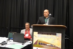 Sean Jones explains Eby-Brown’s rerouting efforts. Matt Granlund of Merchants Foodservice, seated, listens attentively.