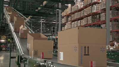 Checking inventory is done by workers who have to use lifts and are harnessed in for safety as they scan products throughout the warehouse. The switch to drones could cut the time it takes to check the inventory throughout a facility that spans roughly 1.2 million square feet, or the equivalent of 26 football fields, from one month to one day.