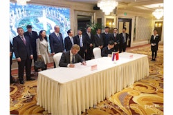 Pavel Sokolov, Russian Railways Logistics CEO and Zhao Wenmin, Zhengzhou International Land Port Development & Construction Co., CEO, sign a strategic cooperation agreement on the organization of international container train Zhengzhou (China) - Europe.