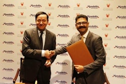 Bahrain's Minister of Industry & Commerce, Dr. Hassan Fakhro and Vishal Tikku, Mondelez International's Area Vice President for the Middle East.