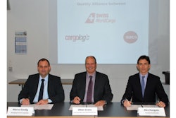 Marco Gredig of Cargologic, Oliver Evans of Swiss WorldCargo, and Alex Hungate of SATS sign the MoU.