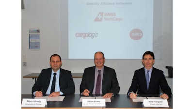 Marco Gredig of Cargologic, Oliver Evans of Swiss WorldCargo, and Alex Hungate of SATS sign the MoU.