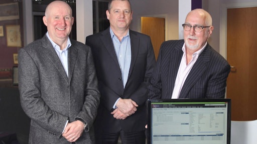 Axida Director Wayne Holgate, left, joins William Salter, CEO and president, Paragon Software Systems, and Len Robinson of Axida.
