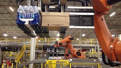 Robots build pallets at the Coca Cola Co. warehouse in Grand Rapids, Mich.
