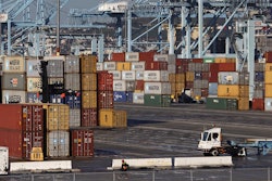 A dock worker arrives at the Port of Los Angeles on Monday, Feb. 23, 2015. Nearly all West Coast seaports began the week with dockworkers hustling to load and unload cargo ships that were held up amid a months-long labor-management dispute.