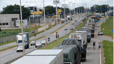 Striking truckers block a federal highway in Goiania, Brazil, Wednesday, Feb. 25, 2015. Weeklong protests by Brazilian truckers demanding lower fuel and toll prices have spread, causing shortages of gasoline and other products.
