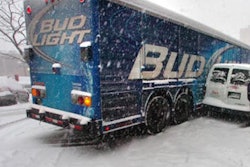 File photo from a 2011 snow storm in Boulder, Colo., involving delivery vehicles.