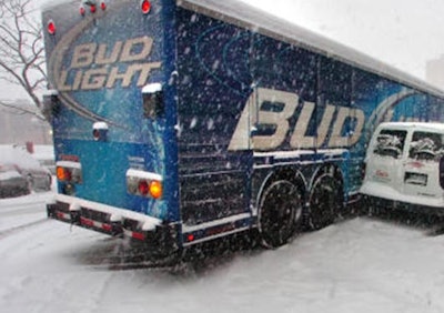 File photo from a 2011 snow storm in Boulder, Colo., involving delivery vehicles.