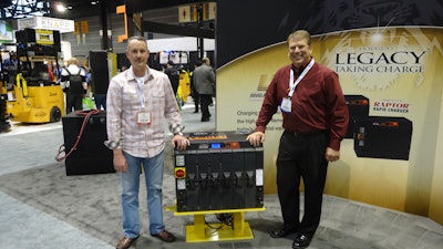 Brian Faust, right, of Douglas Battery shows the Douglas Raptor to Steve Duerr of Minnesota Industrial Battery in Roseville, Minn. at the Promat Show.