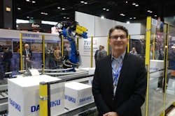 Clint Lasher of Wynright oversees a robotic de-palletizer, which uses 3D vision-sensing technology to de-palletize mixed cases from a Jervis B. Webb SmartCart automatic guided cart.