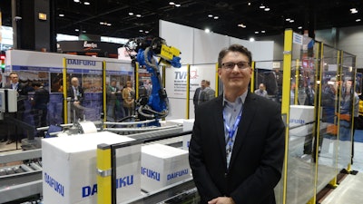 Clint Lasher of Wynright oversees a robotic de-palletizer, which uses 3D vision-sensing technology to de-palletize mixed cases from a Jervis B. Webb SmartCart automatic guided cart.