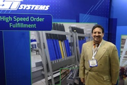Ed Romaine shows a Mobile-atic dispensing system at the SI Systems booth.