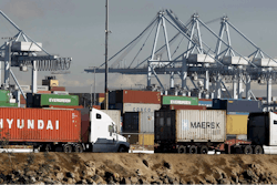 Semi trucks hauling a containers leave the Port of Los Angeles on Monday, Feb. 23, 2015. Nearly all West Coast seaports began the week with dockworkers hustling to load and unload cargo ships that were held up amid a months-long labor-management dispute.