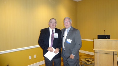 Bud Rodowick of Thermo King, left, and Patrick Brecht of P.E.B. Commodities, Inc. point out problems with the FSMA sanitary transport rule.
