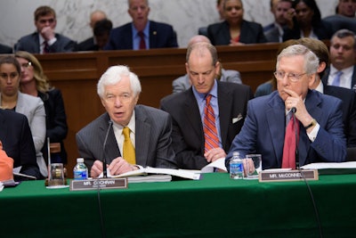 In this file photo Chairman of the Senate Committee on Appropriations Senator Thad Cochran is sitting with committee member Senator Mitch McConnell.