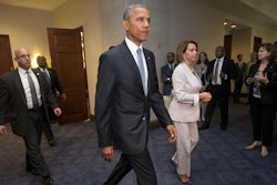 FILE - In this June 12, 2015 file photo, President Barack Obama and House Minority Leader Nancy Pelosi of Calif., leave meeting with House Democrats on Capitol Hill in Washington to discuss the global trade talks.