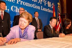 Ambassador Vilma Martinez, left, President of the L.A. Harbor Commission, signs agreement along with Yuan Huahui, center, Deputy Director-General of the Guangzhou Port Authority, and Sanchia Jacobs, Manager Global Partnerships & Strategy, Auckland Council.