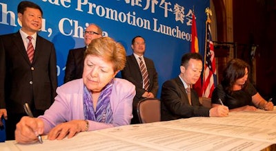 Ambassador Vilma Martinez, left, President of the L.A. Harbor Commission, signs agreement along with Yuan Huahui, center, Deputy Director-General of the Guangzhou Port Authority, and Sanchia Jacobs, Manager Global Partnerships & Strategy, Auckland Council.
