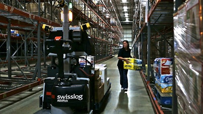 AGVs such as the Swisslog AGV Pick are deploying for mixed case picking in more food warehouses.