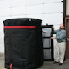 Anthony Dellumo at Q Products & Services readies a quilt to go on a trailer to haul frozen product.