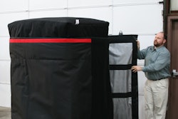 Anthony Dellumo at Q Products & Services readies a quilt to go on a trailer to haul frozen product.