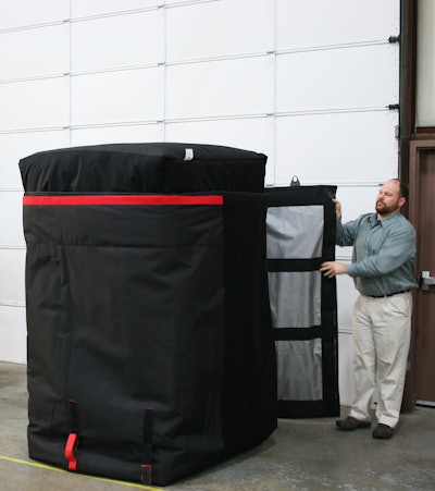 Anthony Dellumo at Q Products & Services readies a quilt to go on a trailer to haul frozen product.