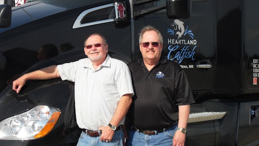 Driver Dennis Jones, left, and James Sorrels, director of transportation, appreciate the savings from aerodynamic features in the Kenworth T680.