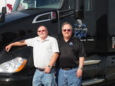 Driver Dennis Jones, left, and James Sorrels, director of transportation, appreciate the savings from aerodynamic features in the Kenworth T680.