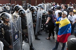 Riot police and protesters in Tachira, Venezuela.