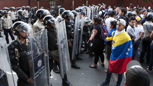 Riot police and protesters in Tachira, Venezuela.