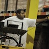 A warehouse employee scans a bar code label.