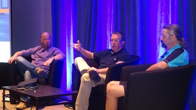 Mark Mullins of Ben E. Keith Foods, center, notes DriveCam’s benefits during the IFDA Solutions Conference in Phoenix, flanked by Mike Hummel of Martin Bros. Co., at left and Danny Duke of Shamrock Food Co., at right.