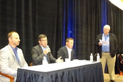 Jon Van Winkle of Omnitracs LLC, center, fields a question on onboard computer technology, flanked by Rustin Keller of J.J. Keller Associates (left) and Rick Ochsendorf of PeopleNet. Lynn Conn of F.A.B. Inc. moderates.