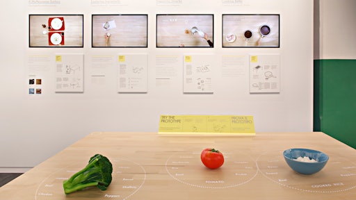 The table's technology developed by IDEO in collaboration with Ikea suggests recipes based on ingredients pushed together on the surface, step-by-step cooking instructions, and information on healthiness, seasonality and cost. The table's inductive surface heats pans and cups to exactly the right temperature, charges your handheld devices, while the projector adds information about remaining cooking time onto pan handles.