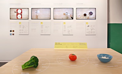 The table's technology developed by IDEO in collaboration with Ikea suggests recipes based on ingredients pushed together on the surface, step-by-step cooking instructions, and information on healthiness, seasonality and cost. The table's inductive surface heats pans and cups to exactly the right temperature, charges your handheld devices, while the projector adds information about remaining cooking time onto pan handles.