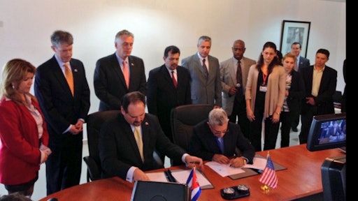 Governor McAuliffe (third from left, back row) and the Port of Virginia delegation witnessing the signing of MOU between the Port of Virginia and the Cuban National Port Authority.