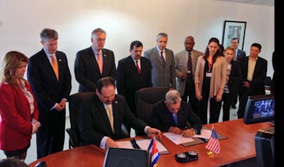 Governor McAuliffe (third from left, back row) and the Port of Virginia delegation witnessing the signing of MOU between the Port of Virginia and the Cuban National Port Authority.