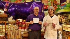 Grocery manager/assistant store manager Wade Combs, left, and service deli overseer Greg Boon display their Food Handler Cards.