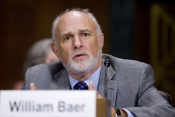 Justice Department antitrust chief Bill Baer, appearing before a Senate antitrust subcommittee, said the voting trust was “an area of concern” because it could allow merging parties to accomplish much of the merger before a government antitrust review had taken place.