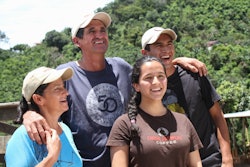 Franco Garbanzo, one of the first farmers to partner with THRIVE Farmers, smiles with his family on their farm 'La Violeta' in Tarrazu, Costa Rica.