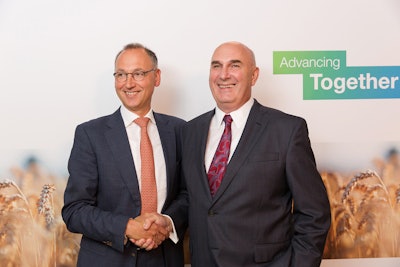 Werner Baumann (left), CEO of Bayer AG, and Hugh Grant (right), Chairman and Chief Executive Officer of Monsanto.