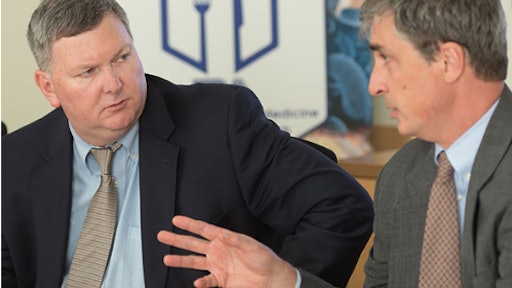 SCORE co-chairs William Correll (left) and Douglas Stearn (right), at a recent team meeting.