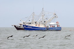 1024px Shrimp boats tow fire resistant oil containment boom in Gulf of Mexico 2010 05 03 2 597797e6e5dc7